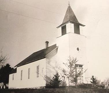 The original Zion building was constructed in Corinna Township in 1888 on County Road 39, and was later picked up and moved into town in 1948.